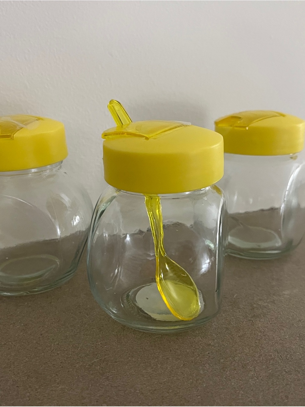 Set of 3 Clear Glass Jars with Yellow Lids and Spoon